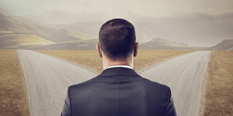 a person standing at a fork in the road