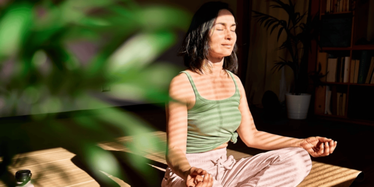 woman meditating or practicing mindfulness, symbolizing a calm and focused mindset.